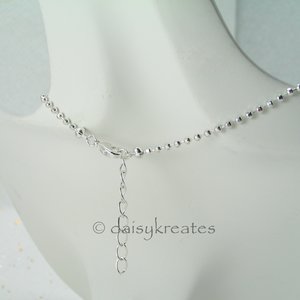 The Mandala pendant comes on a ball chain adjustable from 18" to 19 1/2"