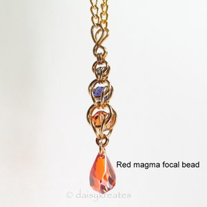 Golden Harvest Y necklace with red magma focal drop bead