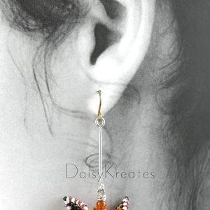 Each Monarch butterfly earring can swivel for front or back side view