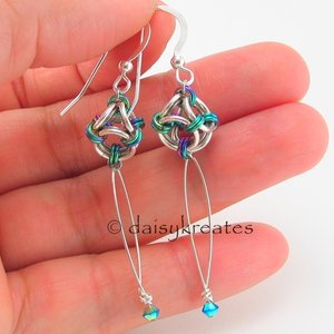 These pretty earrings are made of sterling silver, natural titanium, anodized ni