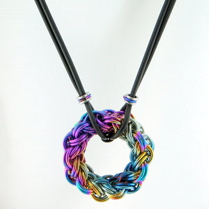 Circular chainmaille pendant in kinged/doubled Vipera Berus weave