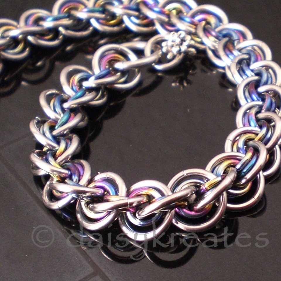 3x3 Wave Bracelet in stainless steel and rainbow anodized niobium
