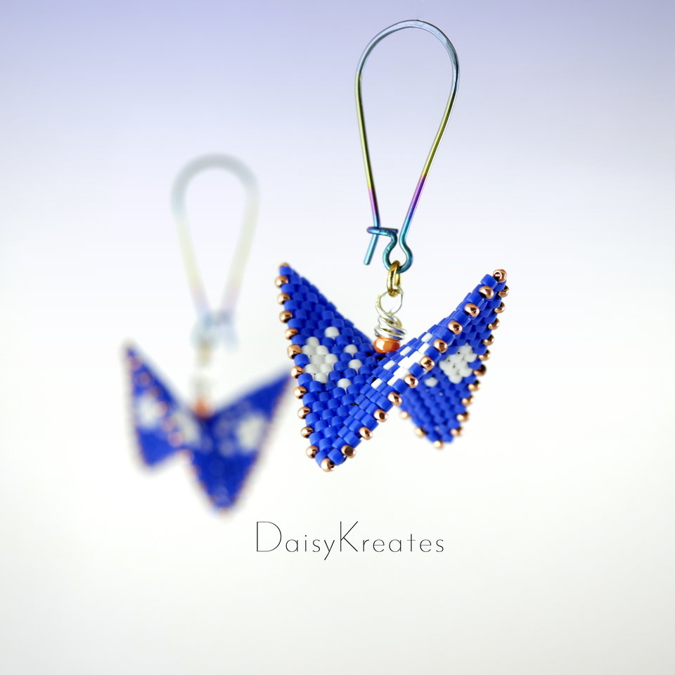 Blue and white paw print earrings in contemporary geometric style