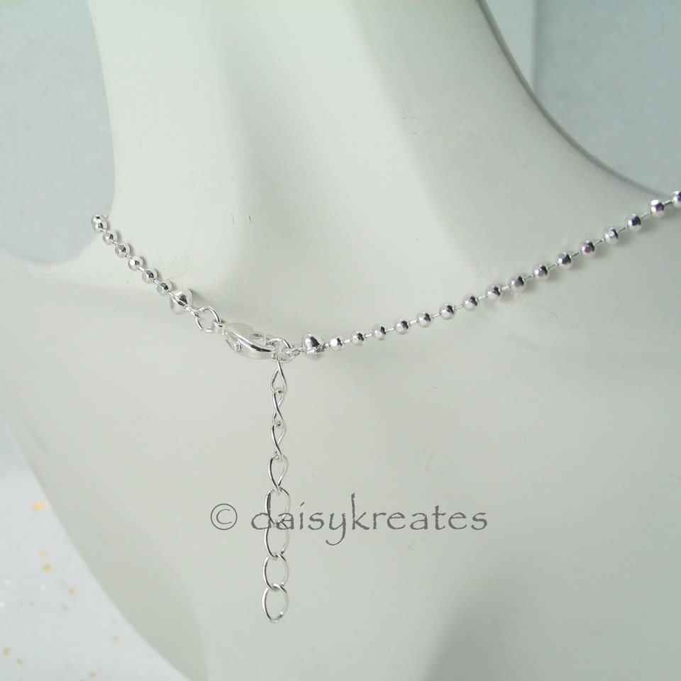 The Mandala pendant comes on a ball chain adjustable from 18" to 19 1/2"