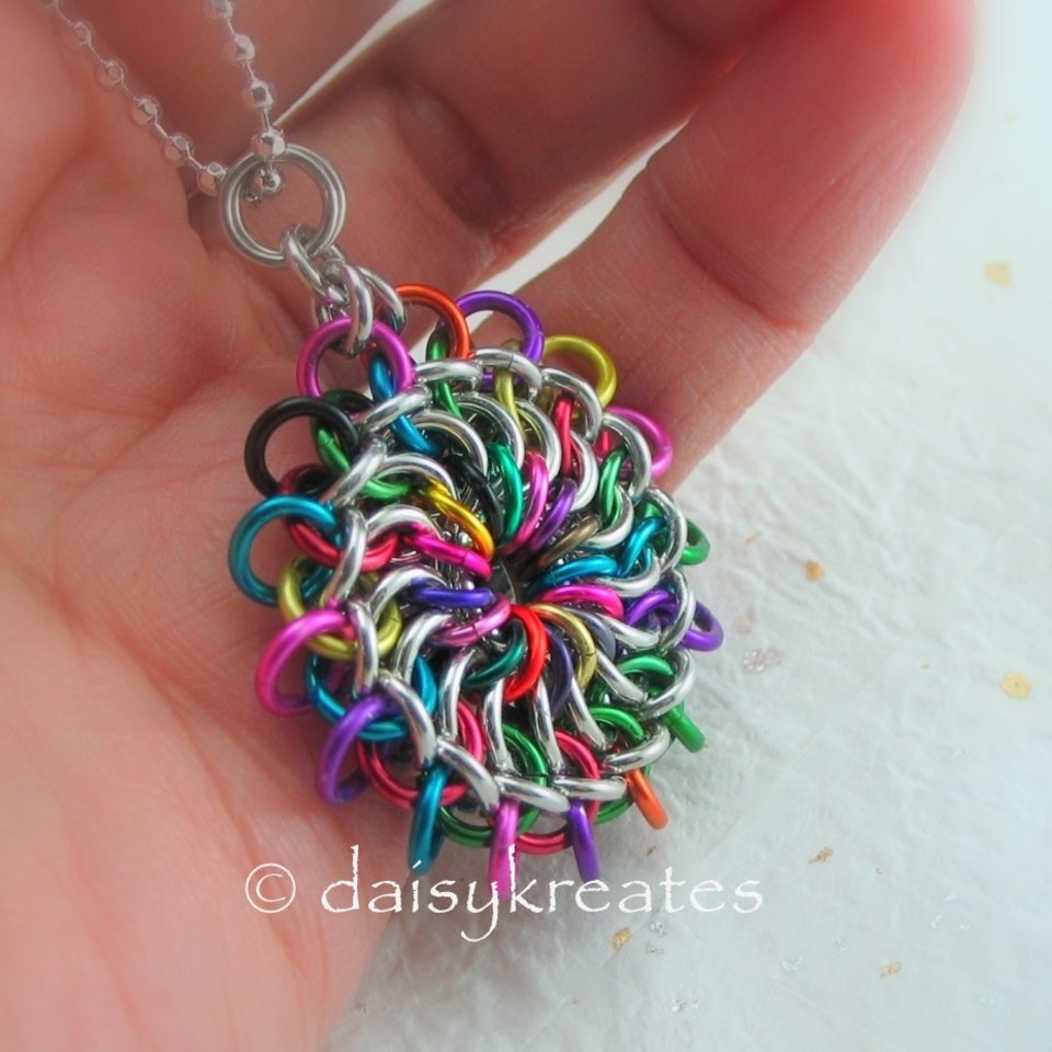 Chainmaille Mandala Pendant's colors reminiscent of Tibetan sand mandala
