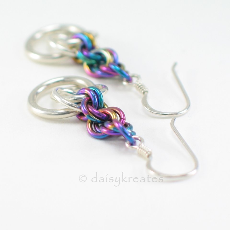 Beautiful Tea Rose earrings with soft glow of silver and colorful rainbow