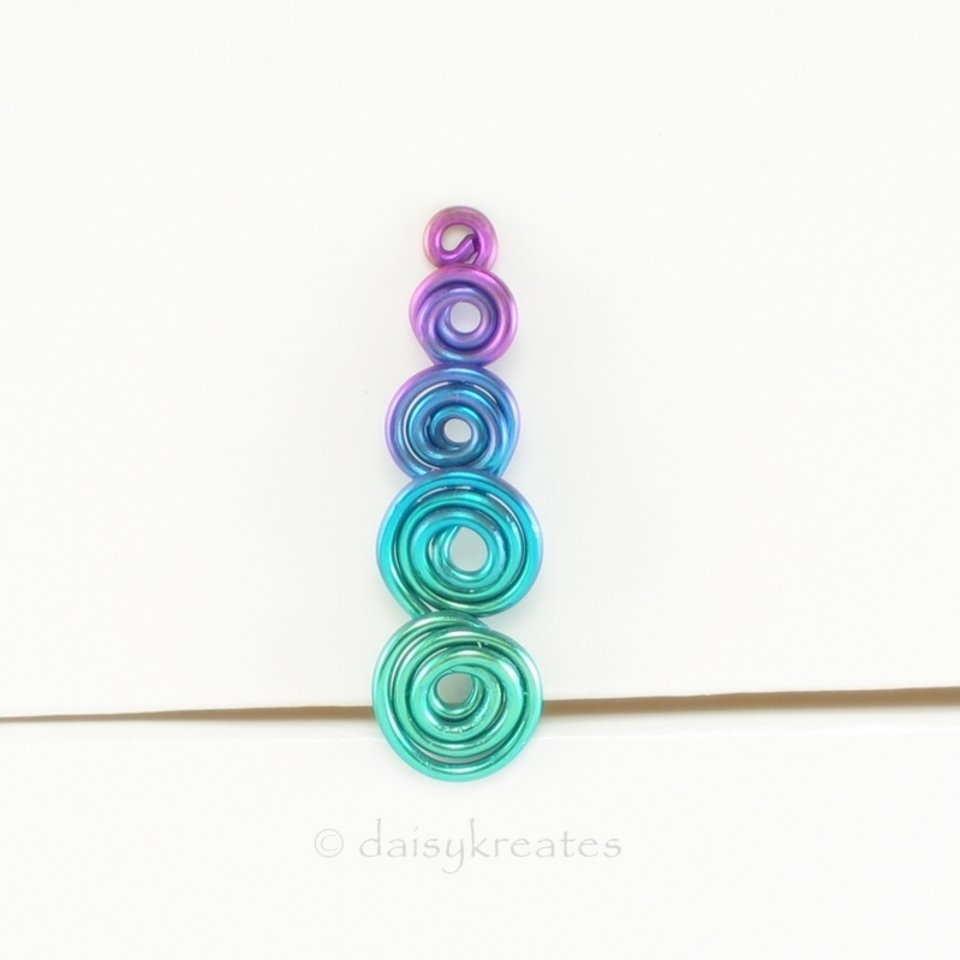 Multicolor Koru Spiral Ear Climber in Anodized Pure Niobium