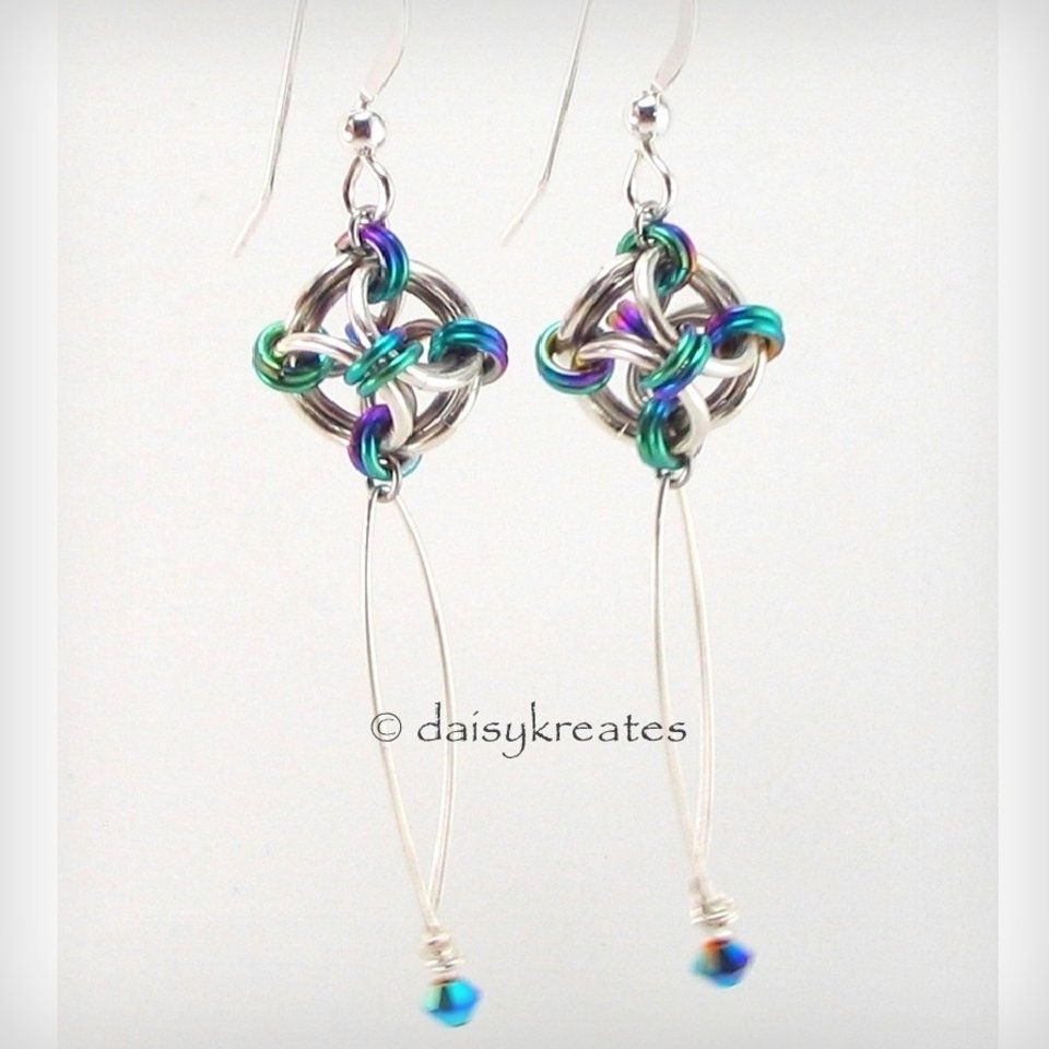 Lovely sterling silver Nox earrings with rainbow hightlights