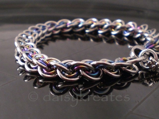 3x3 Wave Bracelet in stainless steel and rainbow anodized niobium